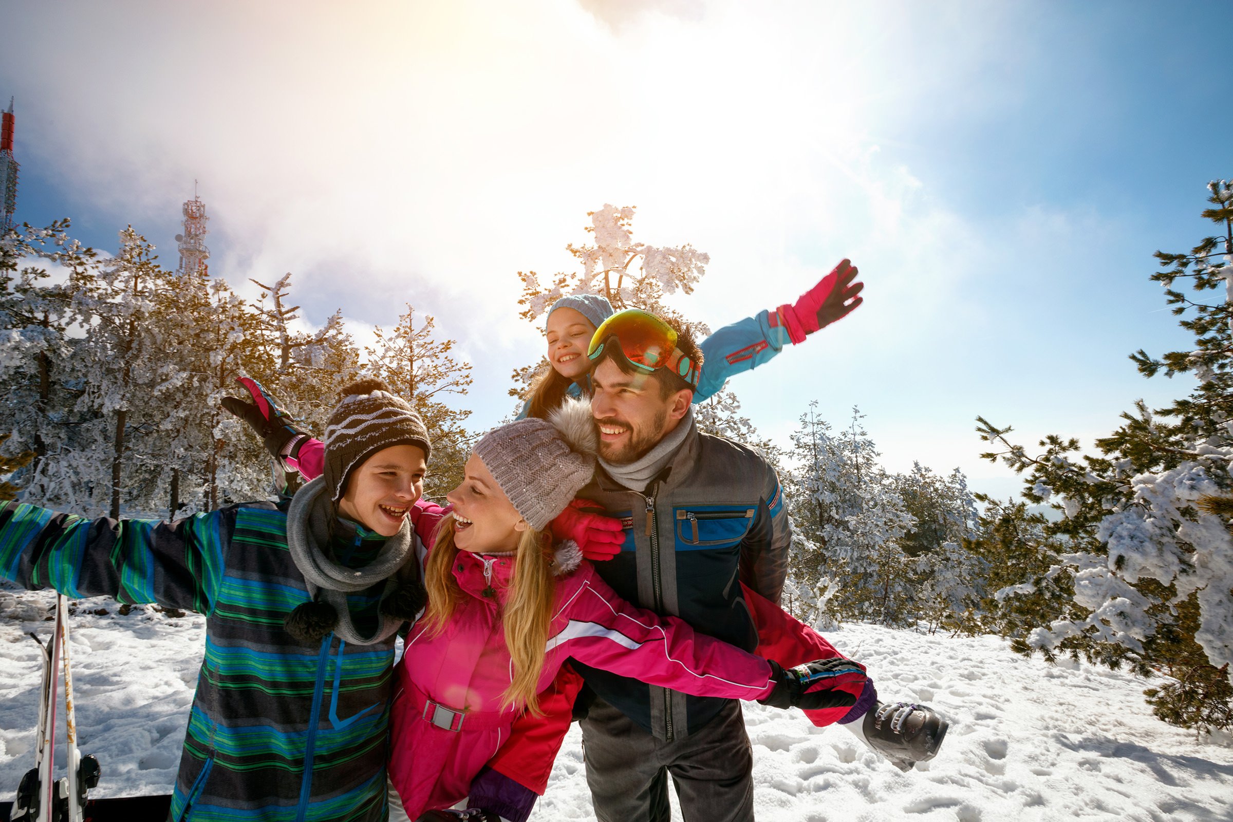 Happy family enjoying winter vacations in mountains