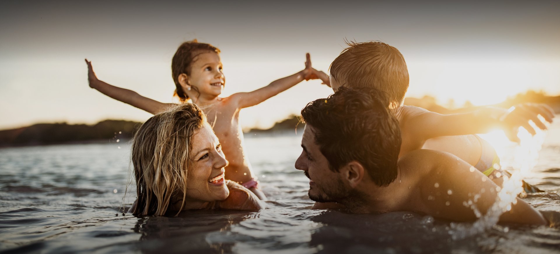 Family playing in the water